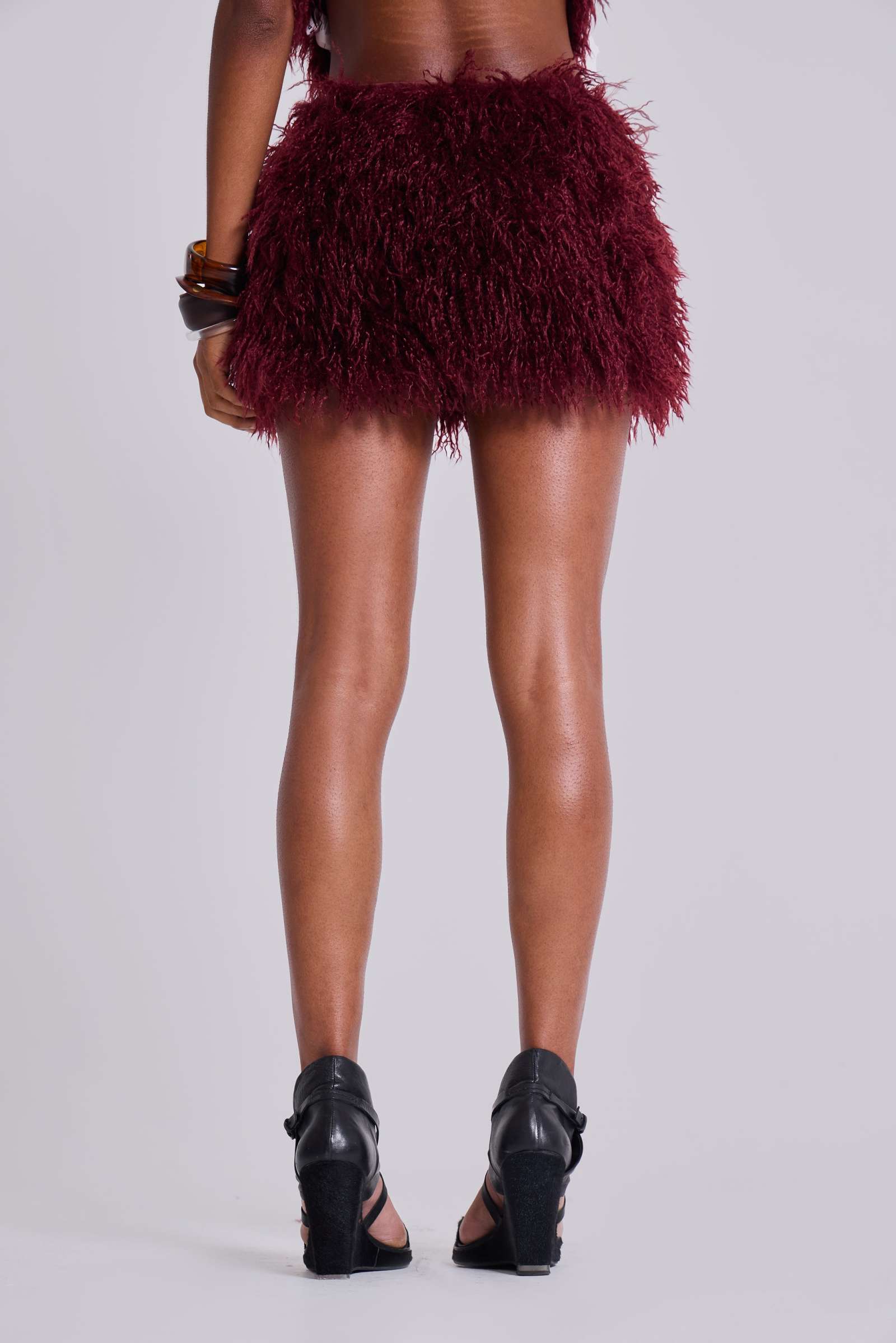 Haka Mongolian Faux Fur Mini Skirt in Wine