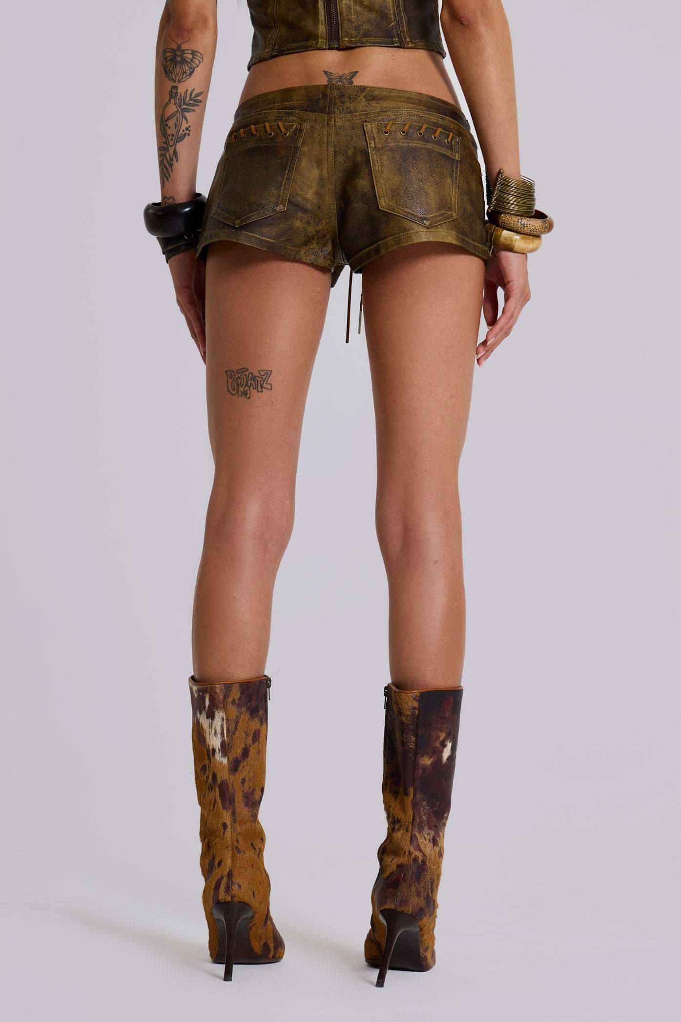 Vaca Whipstitch Faux Leather Mini Shorts in Brown