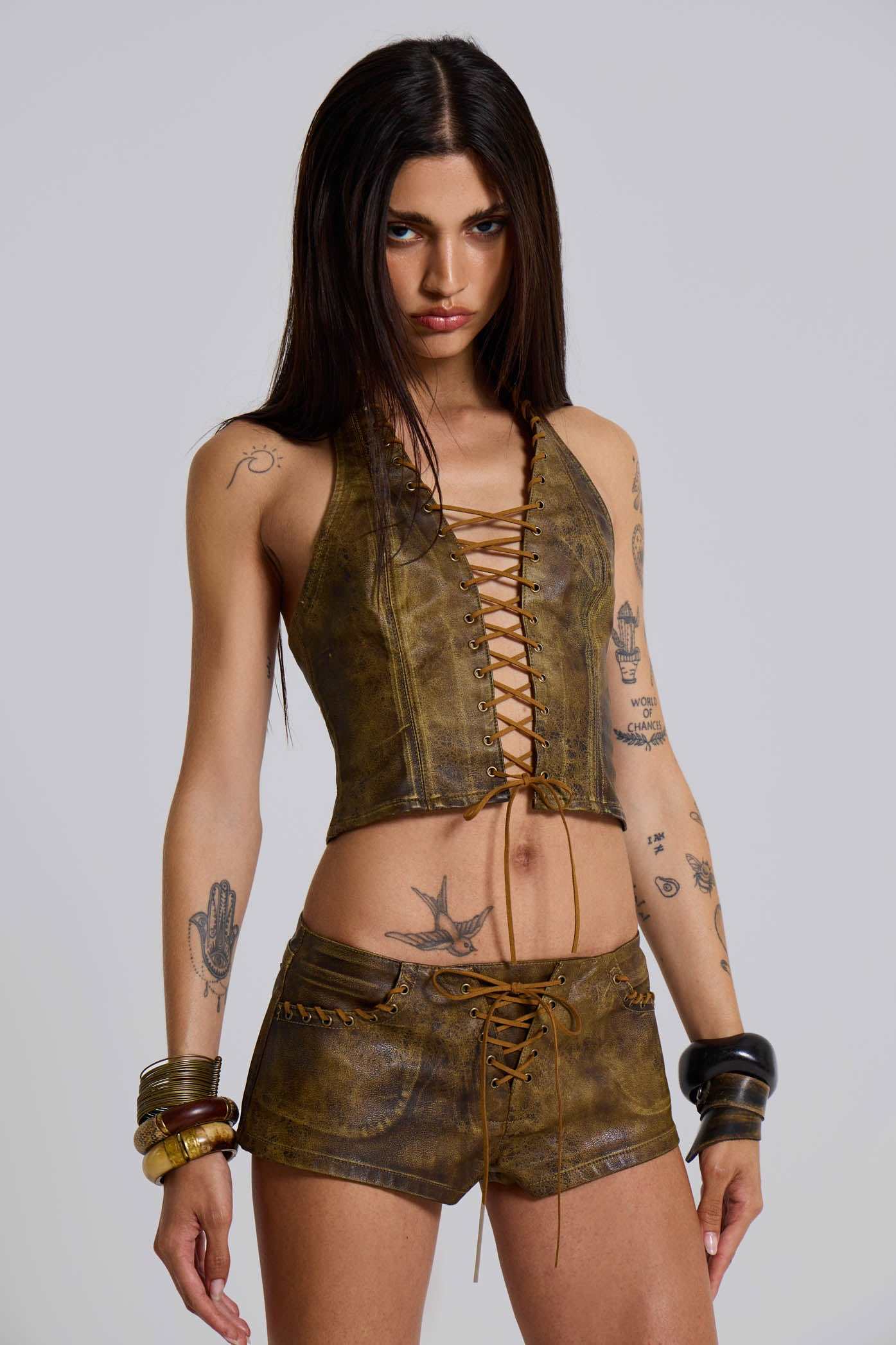 Vaca Whipstitch Faux Leather Mini Shorts in Brown