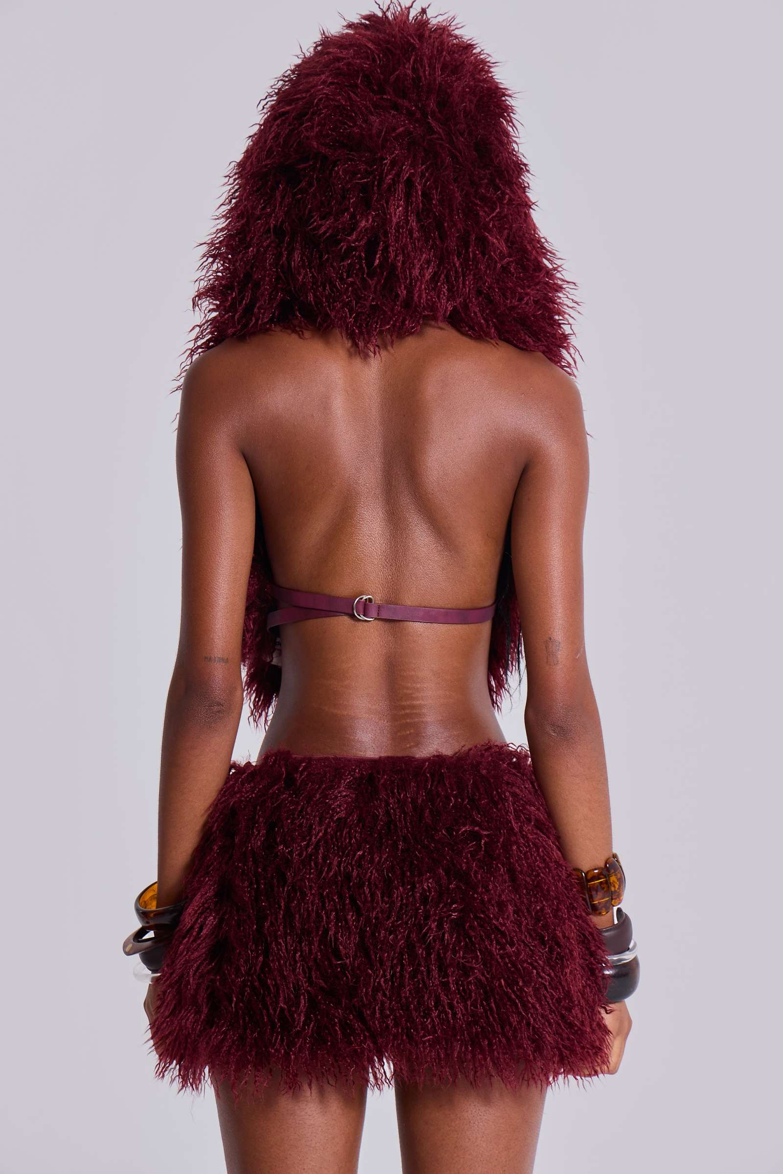 Haka Mongolian Faux Fur Backless Top in Wine