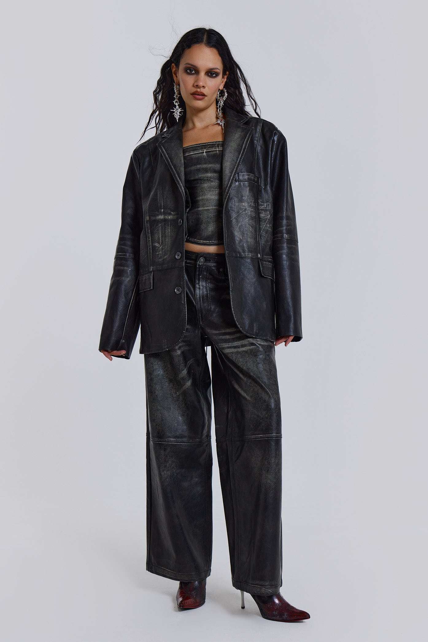 Introducing the Ash Blazer - crafted from a faux leather PU fabric with a unique heavy acid wash finish in an off-black colourway, this oversized fit blazer features a two-button front, jet pockets with flaps on the chest and a back vent, the blazer is fully lined and perfect for layering.